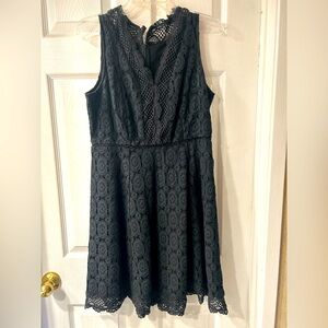 Black lace, above the knee length, sleeveless dress.  excellent condition.